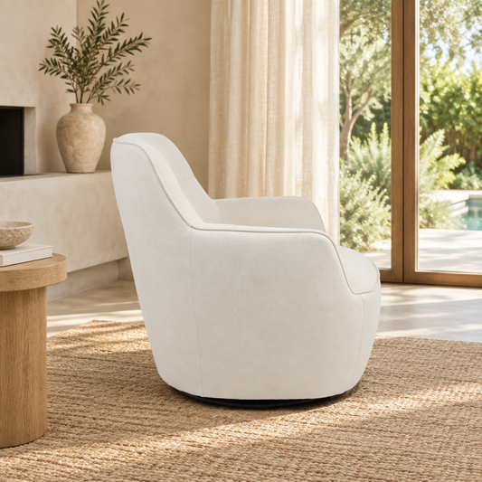Side view of the Bumble beige swivel armchair and curved backrest