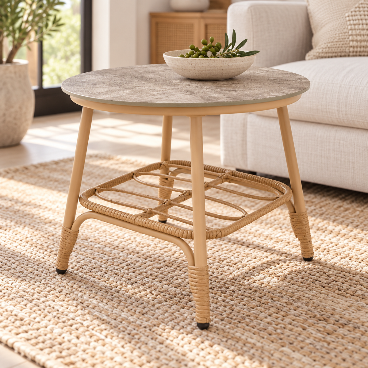 Miami round outdoor side table, ceramic tabletop beside a sofa