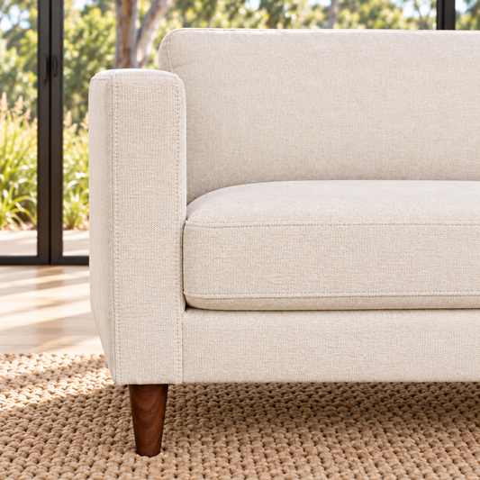 Sam fabric sofa arm, seat cushion and timber-look leg close-up